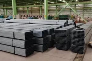 ZN-AL-MG custom solar panel bracket solar tracking system with ZAM steel profiles stored in warehouse for photovoltaic mounting system production and assembly-banner