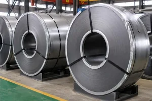 Cold rolled non-grain oriented steel coil stored in a steel manufacturing warehouse for motor and generator electrical steel applications banner