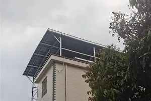 Hollow section Zn-Al-Mg solar mounting bracket supporting residential rooftop photovoltaic panels on a modern house for durable PV installation banner