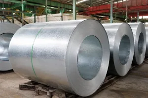 Galvalume and galvanized steel roofing coils stored in a warehouse for steel distributor inventory and supply chain management banner