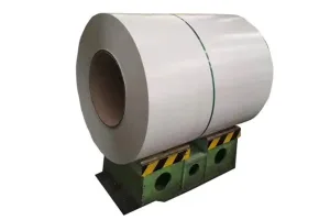 silver gray steel coil with a smooth metallic finish, secured with a green steel band and positioned on heavy duty industrial supports.